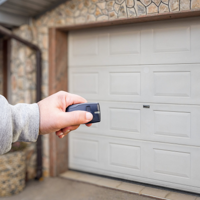Richmond security key fob pointing to a garage door